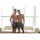 Two males topless hugging