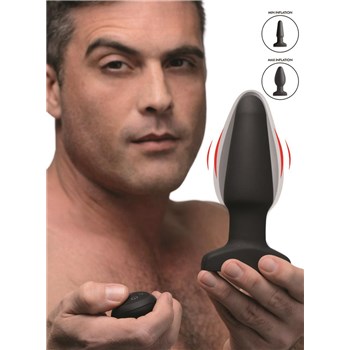 Swell 10X Vibrating Butt Plug held by male
