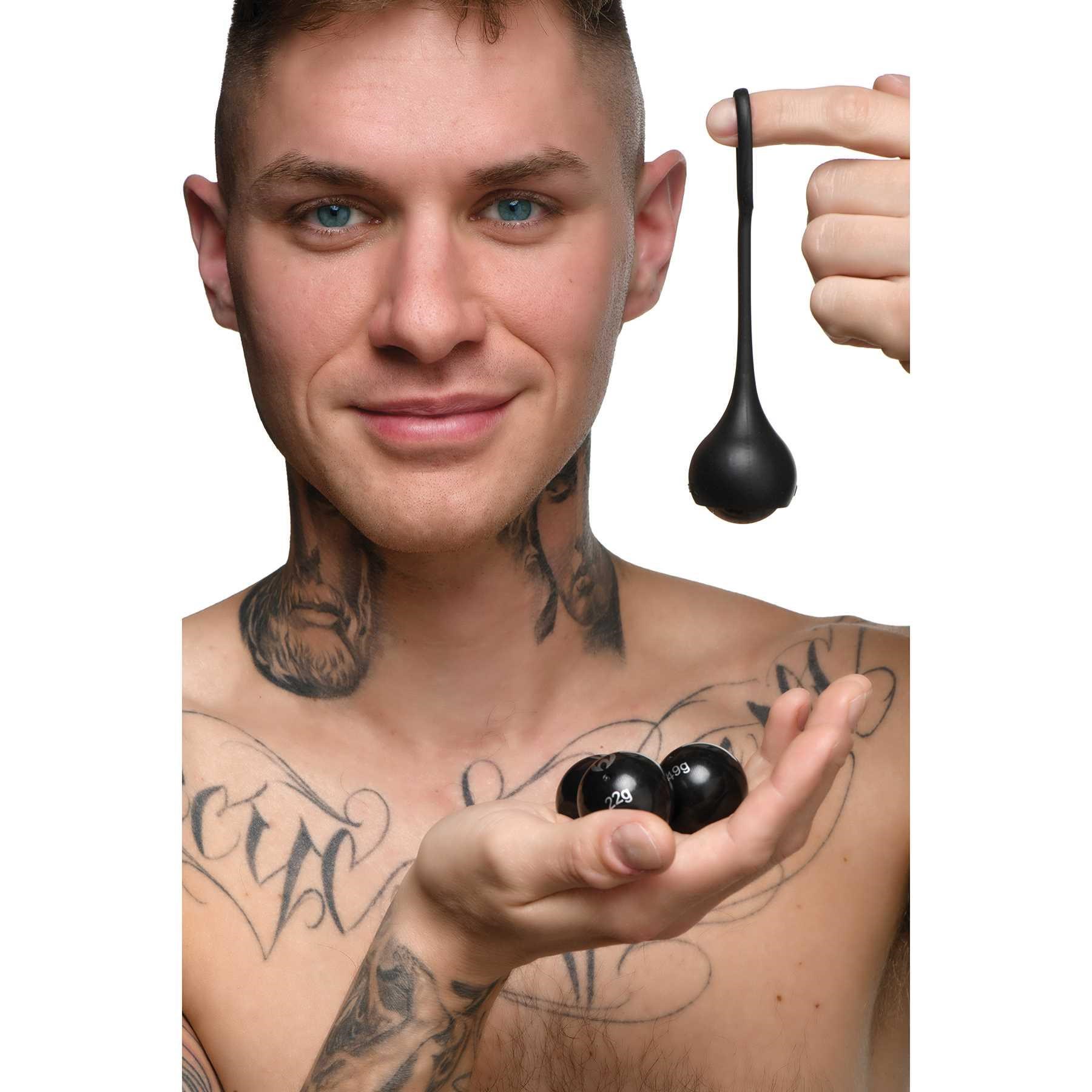 Cock Dangler Penis Strap held by male model