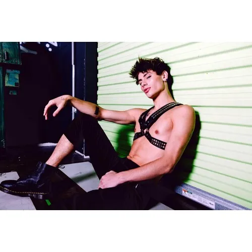 Male model wearing leather harness front view