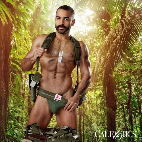Male posed in woods wearing jock strap displaying abs